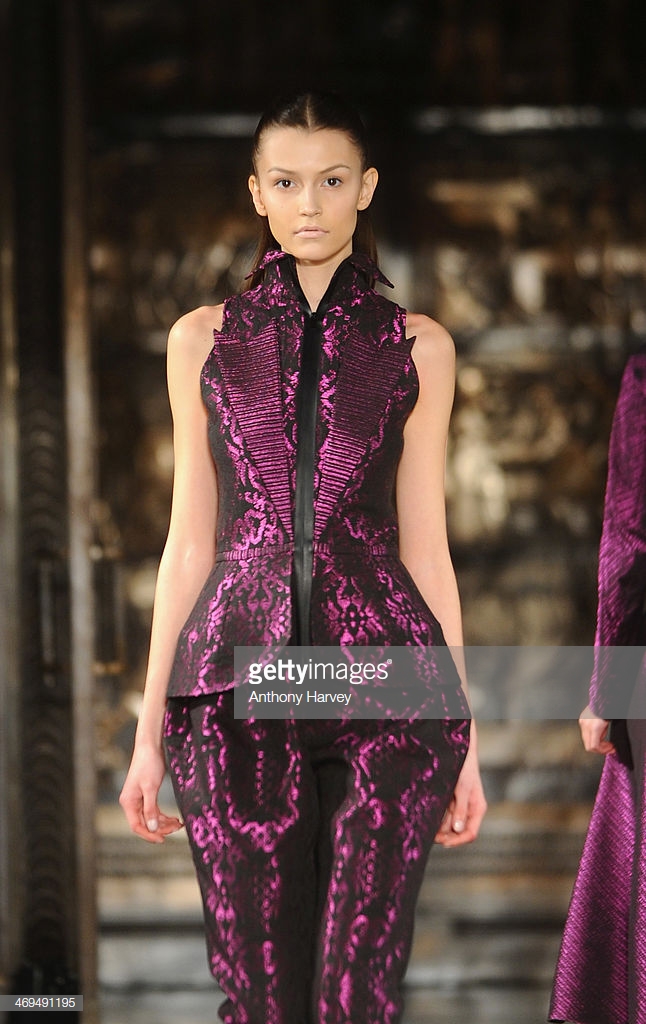 LONDON, ENGLAND - FEBRUARY 15:  A model walks the runway at the Bernard Chandran show at the Fashion Scout venue during London Fashion Week AW14 at Freemasons Hall on February 15, 2014 in London, England.  (Photo by Anthony Harvey/Getty Images)